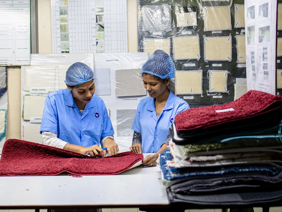 Quality control team inspecting a bulk garment order under the AQL 2.5 standard