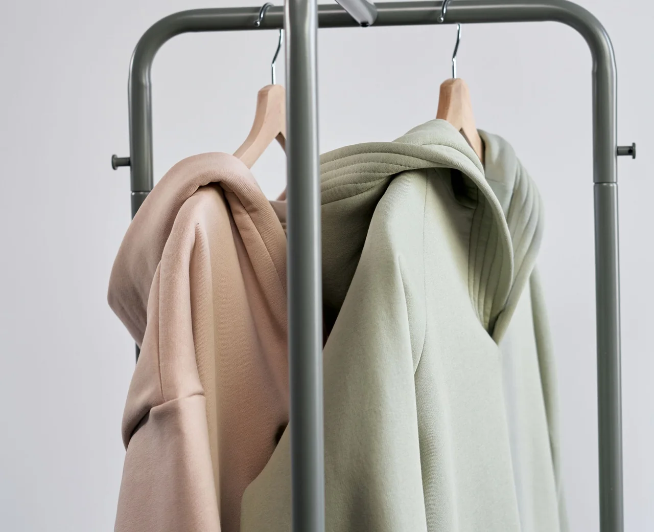 Blank hoodies on a garment rail ready for a seasonal streetwear drop