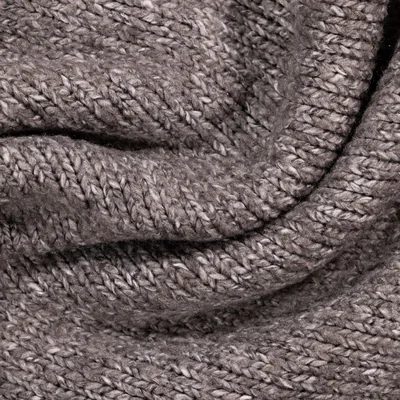 Grey knitted fabric swatch close-up