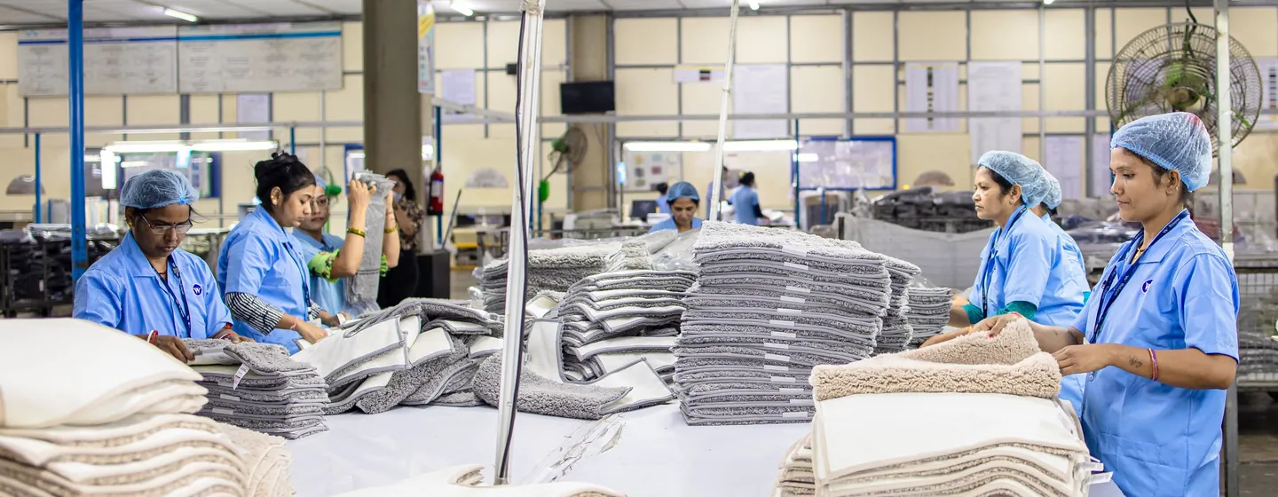 Sale Smart Sports apparel production floor with workers sorting and folding finished garments