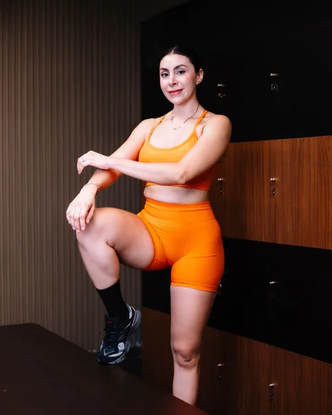 Matching activewear training set in orange, a private label activewear style