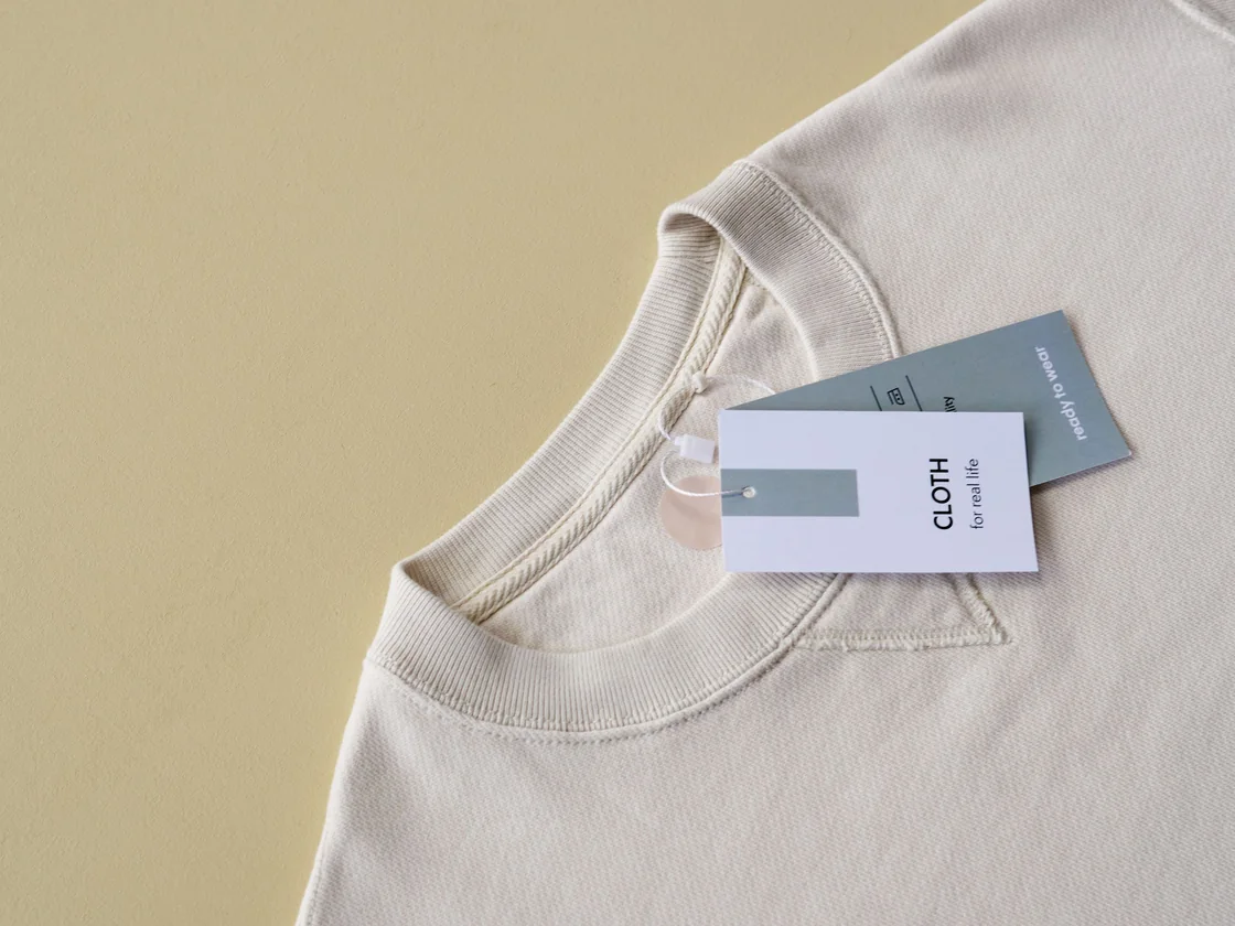 Custom woven label and printed hang tags on a private label streetwear sweatshirt