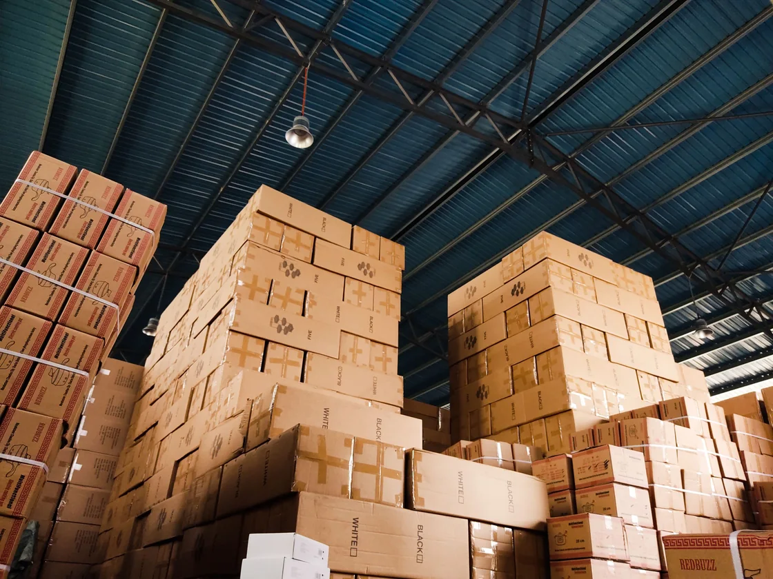 Stacked export cartons of finished streetwear ready for international shipping