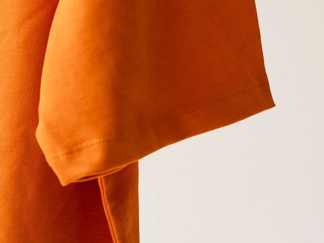 Twin-needle hem with two parallel rows of stitching on a knit sleeve